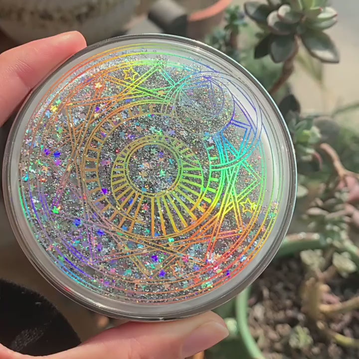 Silver Quick Sand lens kit, glitter moving in the lid, then opened to show the mirror, lens case, tweezers, applicator and bottle